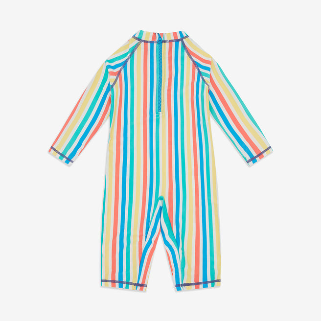 A UV Protective Surf Suit Multi Stripe in a colourful vertical stripe design, featuring long sleeves and short legs with a blue zip on the back.